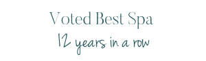 Text banner for Scents of Serenity Day Spa, reading 'Voted Best Spa 12 years in a row' on a black background.